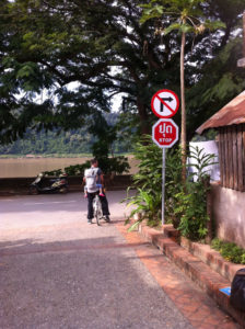 Bert with Gaia in the Sling riding along the peaceful streets